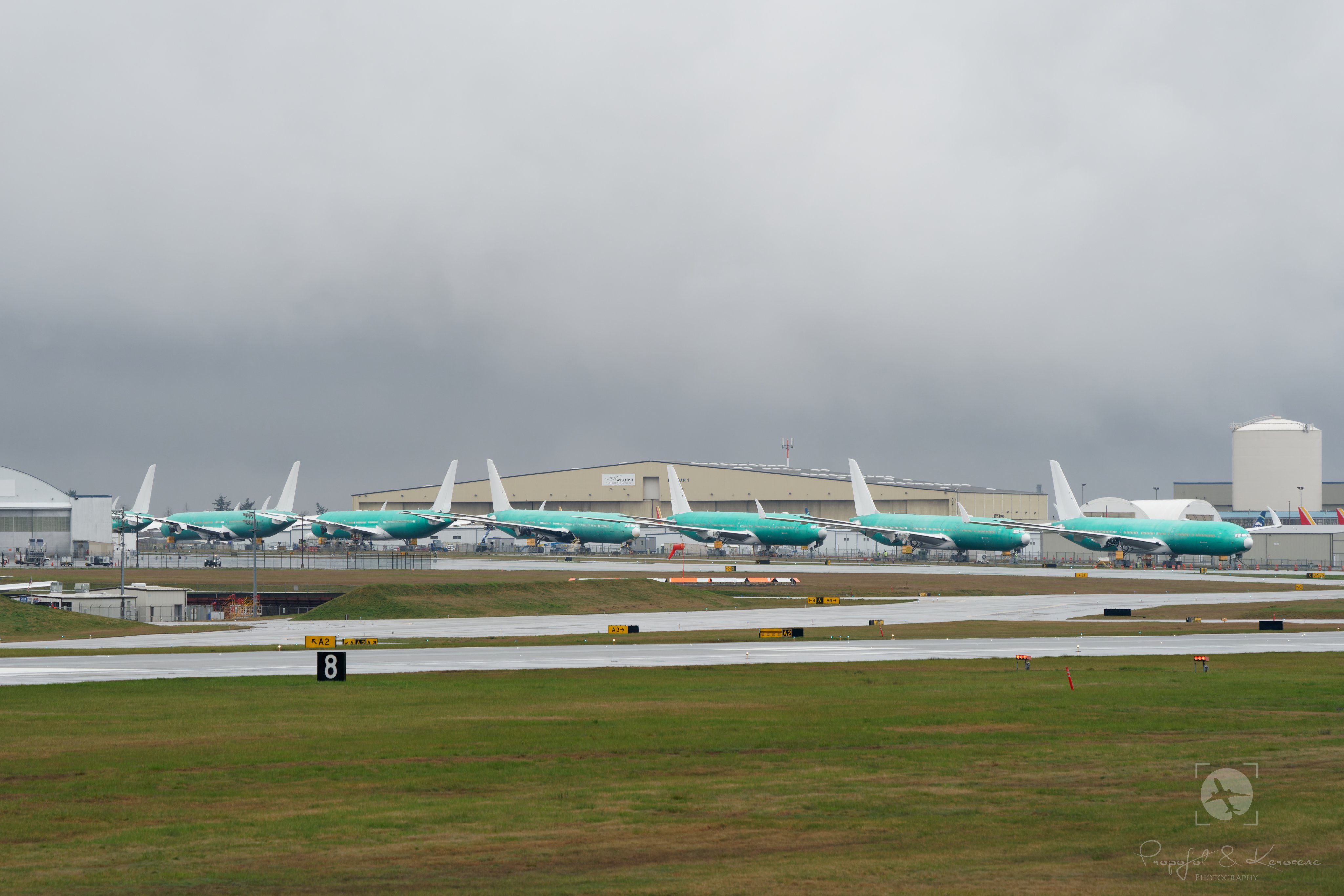 Boeing 777X program delay piled up many Shark finned white tails parked one after another at KPAE - Paine Field.